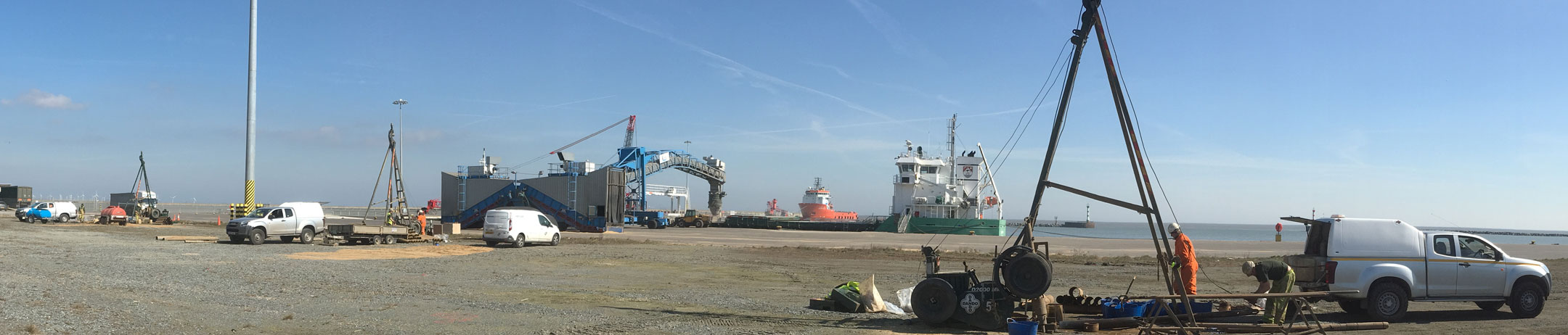 Geotechnical engineering. Site investigation. Three cable percussive drilling rigs at work in Great Yarmouth outer harbour